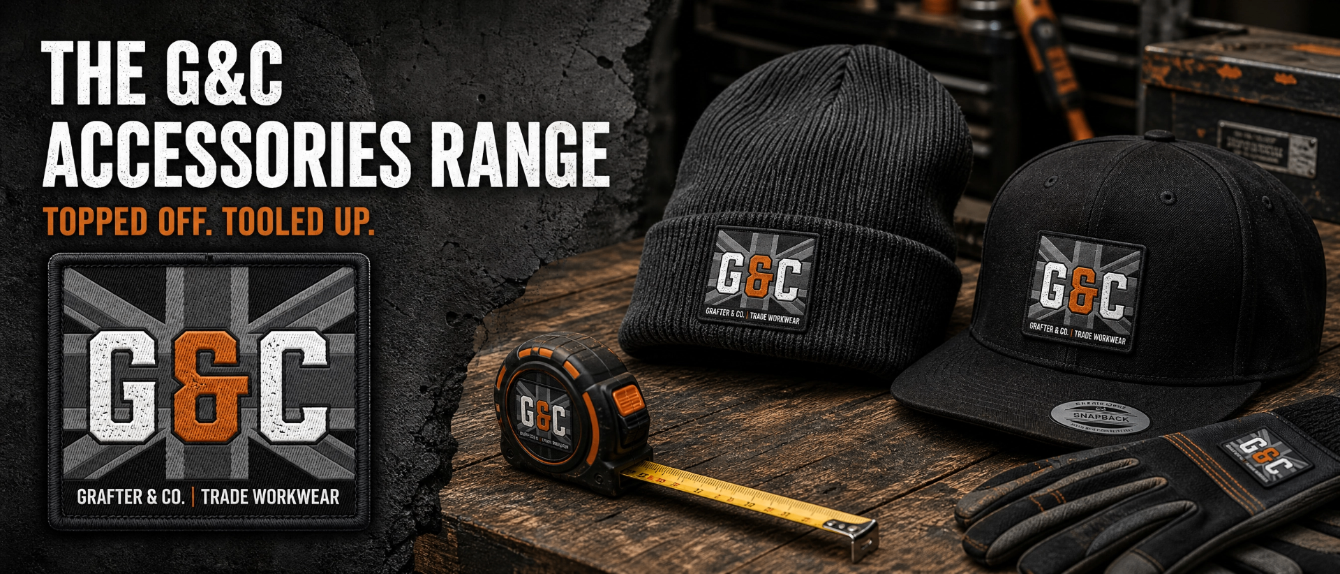 Accessories range banner featuring the G&C union jack monogram patch alongside a beanie, snapback, tape measure and gloves on a workbench, headline 'The G&C Accessories Range — topped off. Tooled up.'