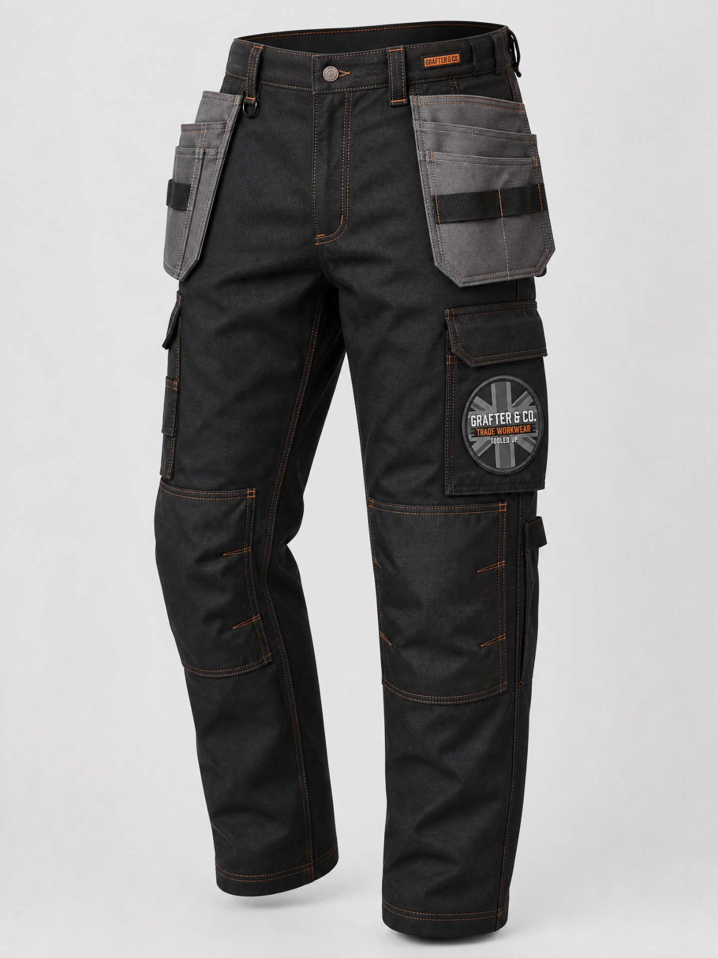 Black Grafter & Co. work trousers with grey holster pockets, orange stitching and union jack cargo patch